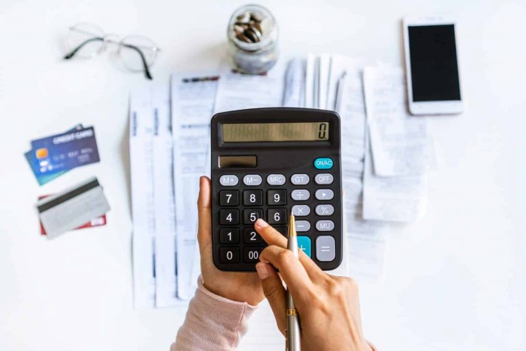 hand calculating monthly installment loan payment