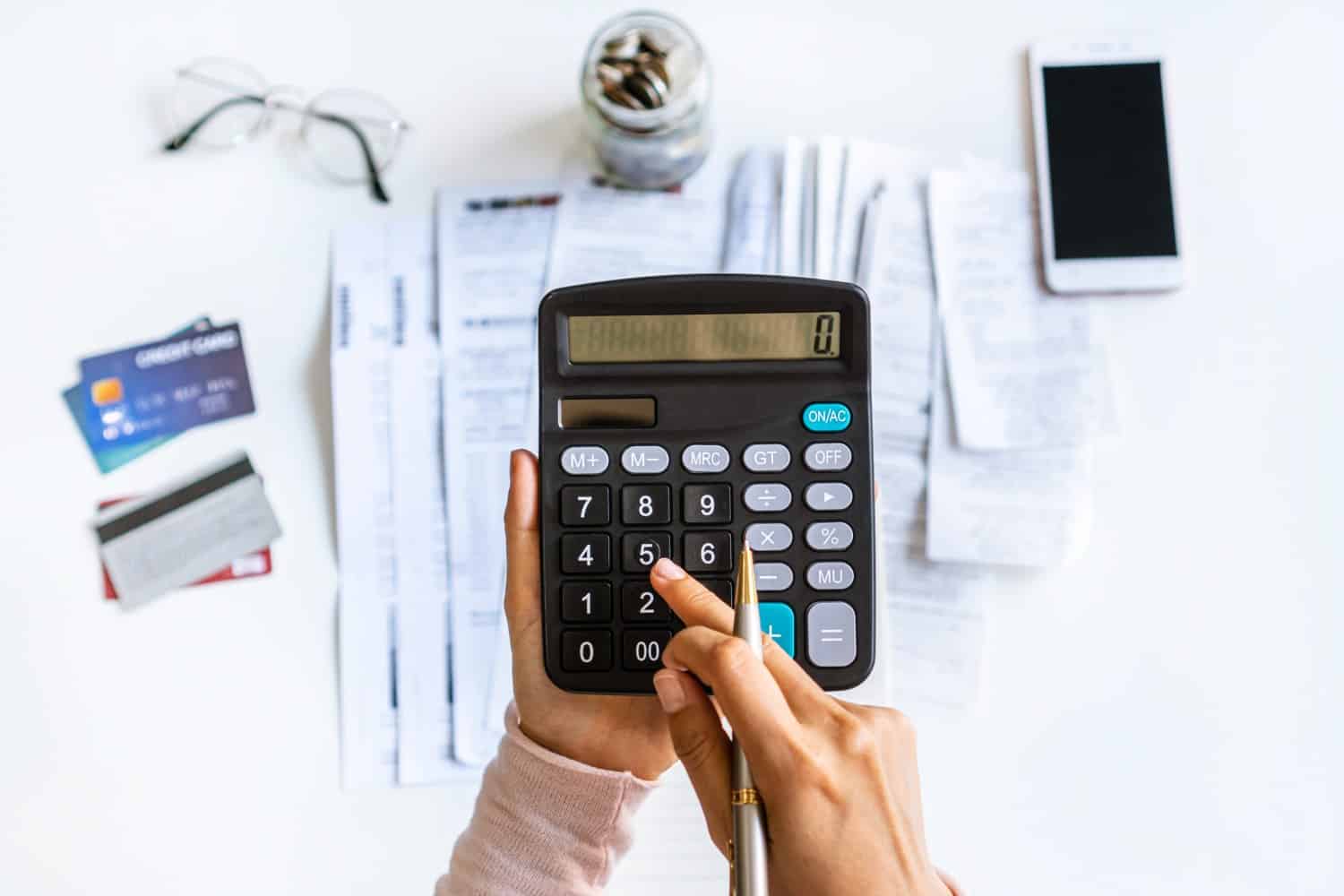 hand calculating monthly installment loan payment