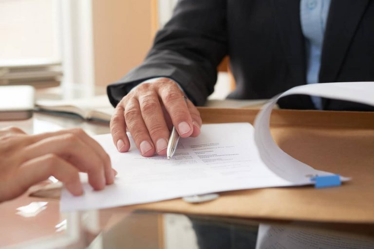 Man signing contract with moneylender
